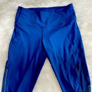 Blue Lululemon capri leggings with mesh side detailing; lightly used